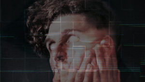 a man with his hands on his face. his puppils aren´t visible